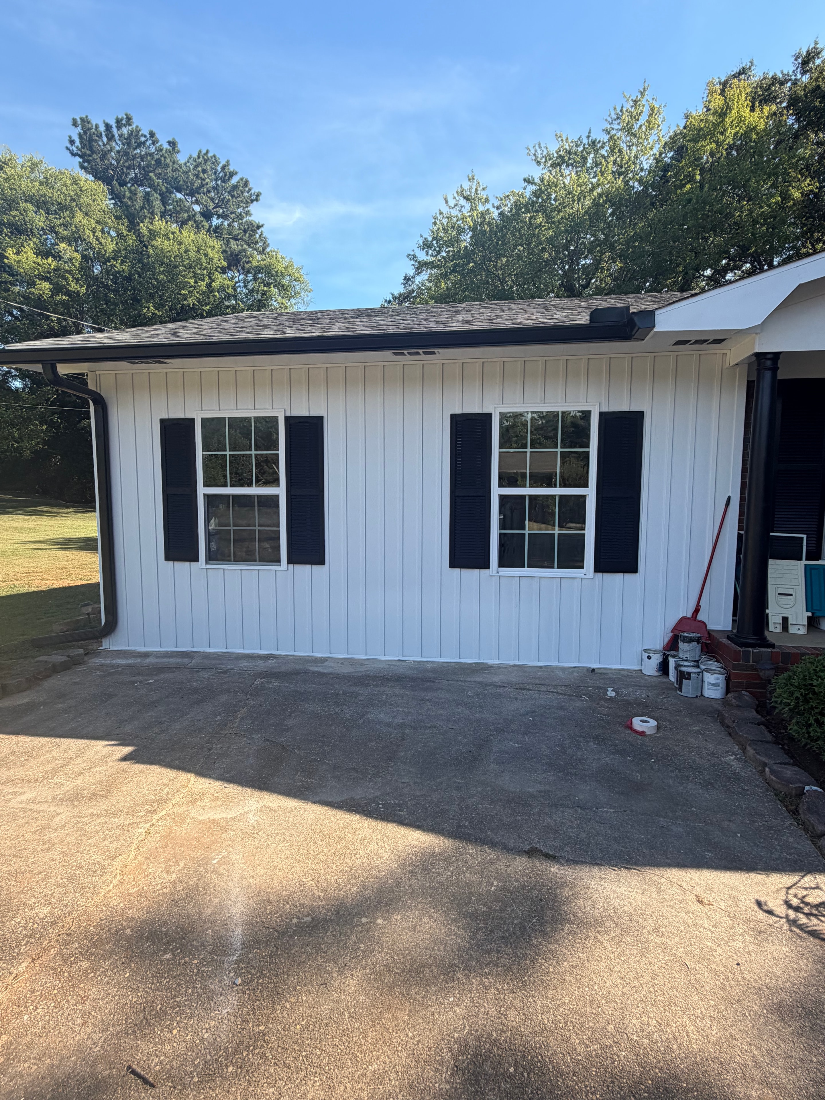 Before — open carport attached to brick ranch home